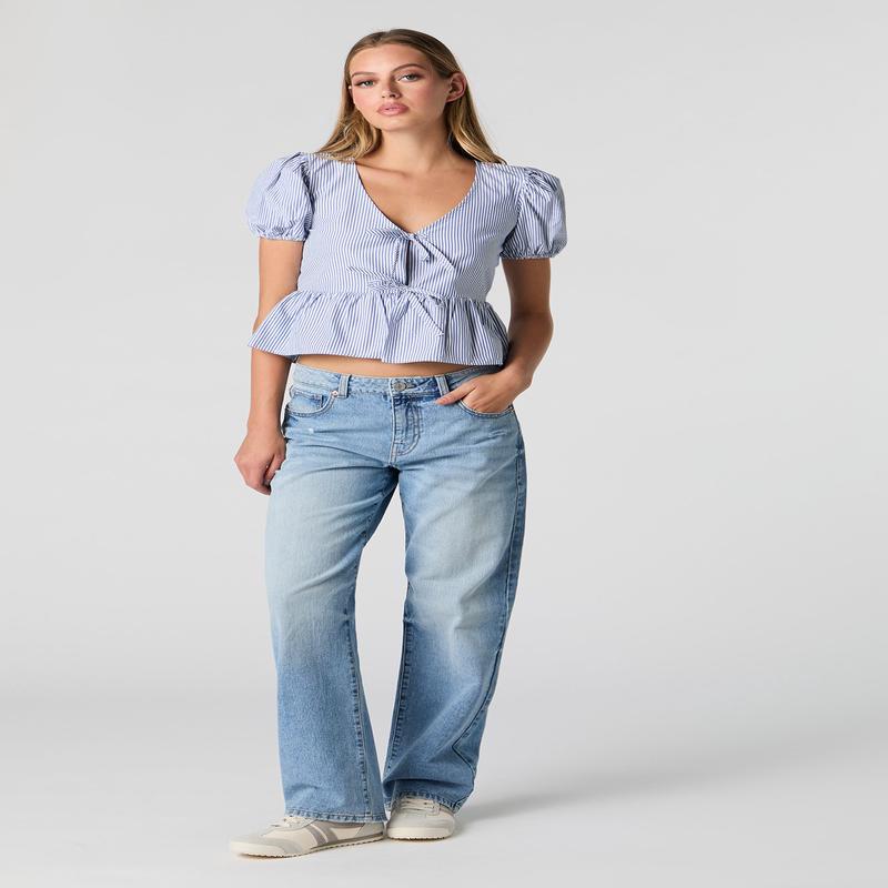 Jean rigide ample  jambe droite d'aspect us dlav moyen